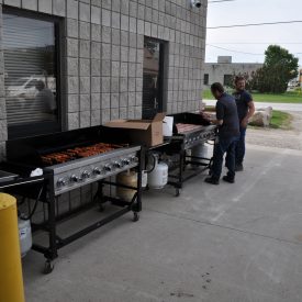 Two large barbecues outside of Calframax